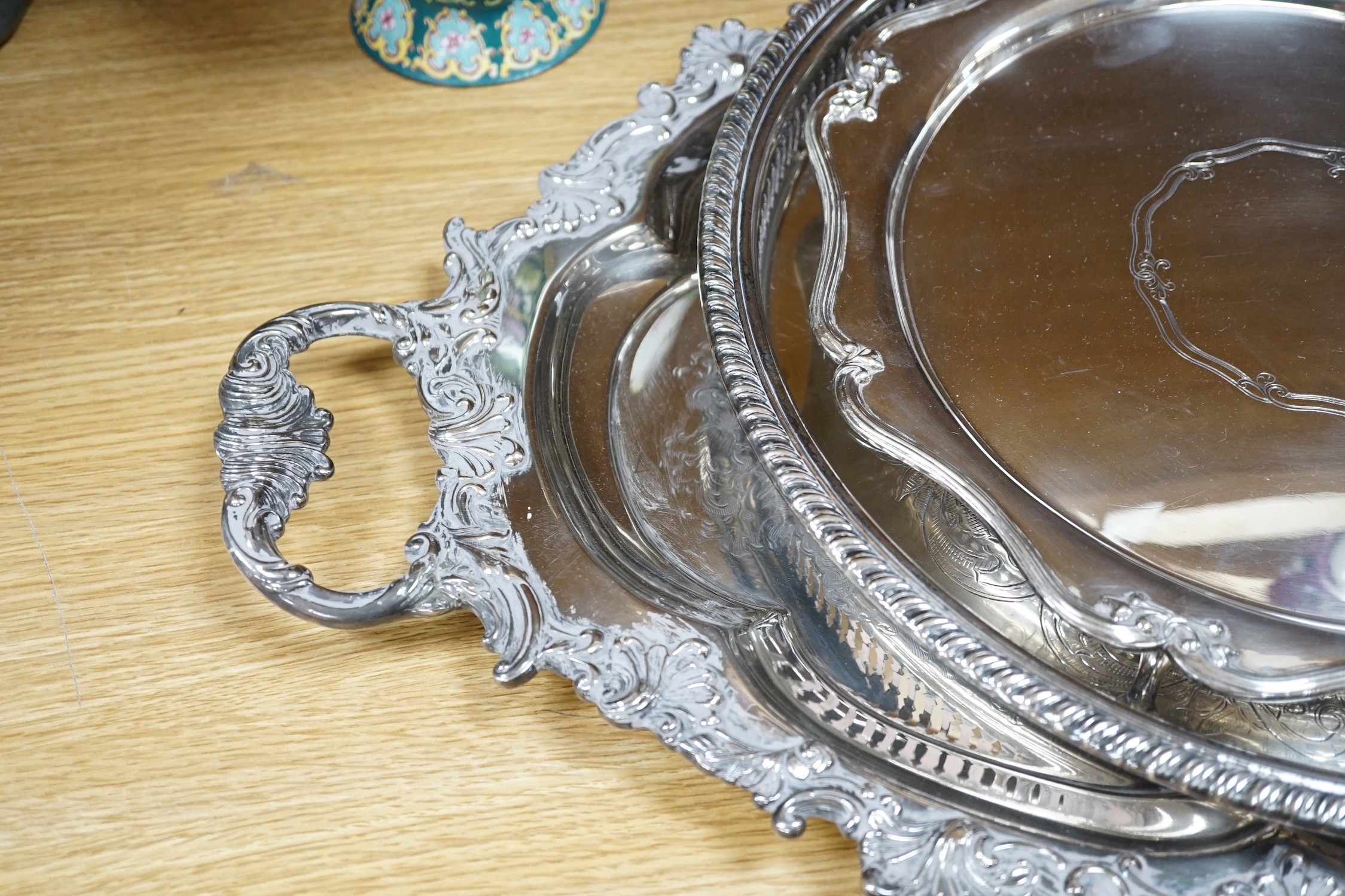 A large Victorian two handled silver plated tray and two others. Largest 65.5cm handle to handle